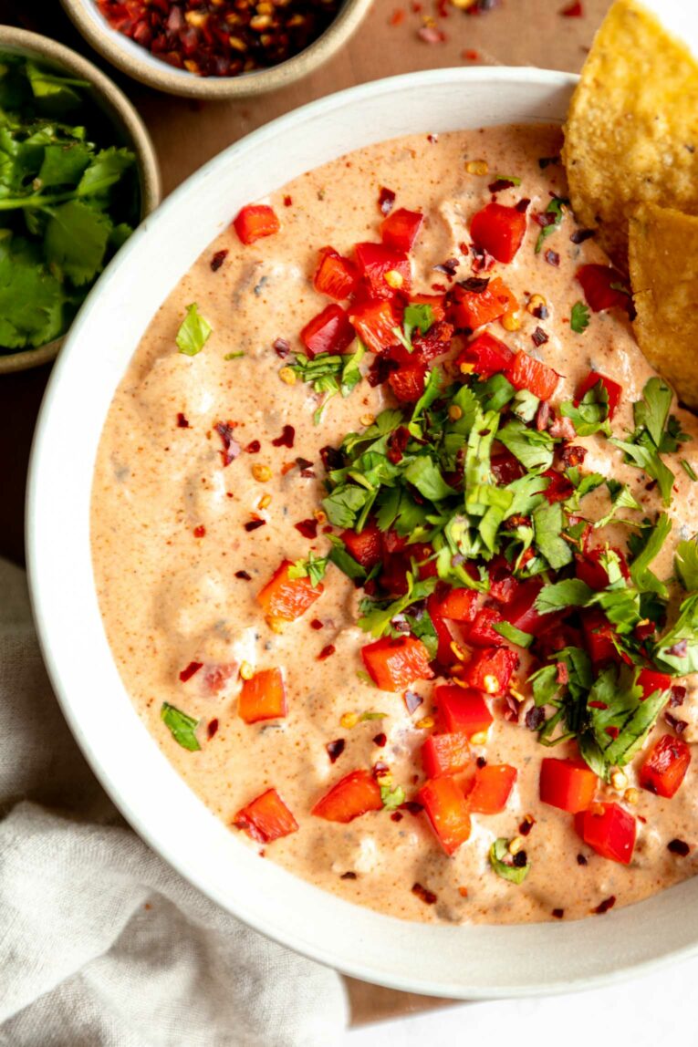 Close up of rotel dip recipe with chopped peppers on top.