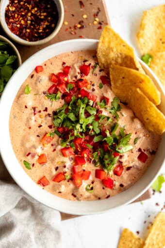 Healthier Rotel Dip in a bowl with tortilla chips.