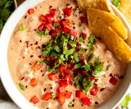 Healthier Rotel Dip in a bowl with tortilla chips.