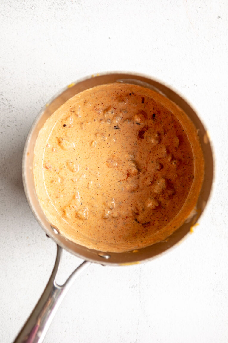 Ingredients for Healthier Rotel Dip being cooked together in a pan.