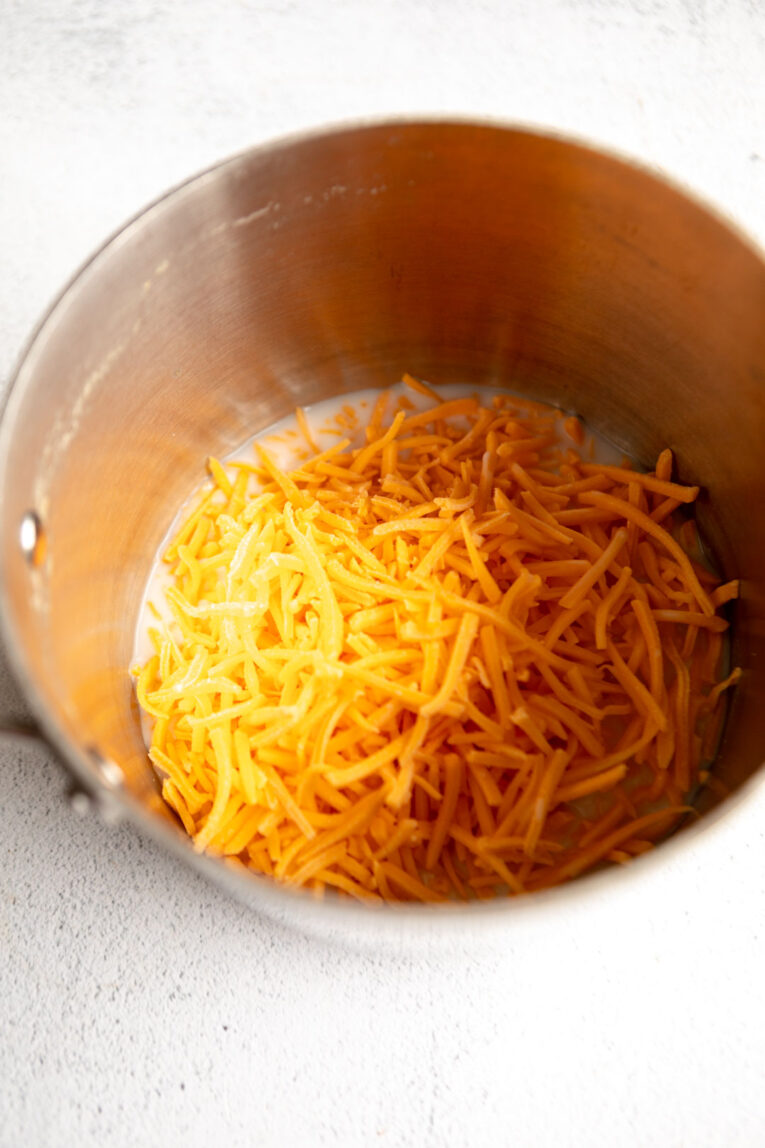 Cheese melting in a saucepan.
