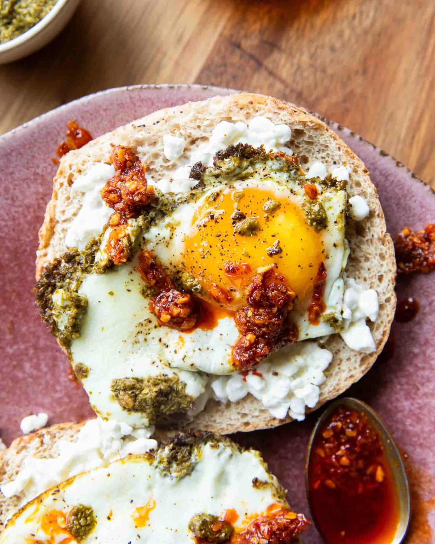 Pesto Eggs on a bagel slice.