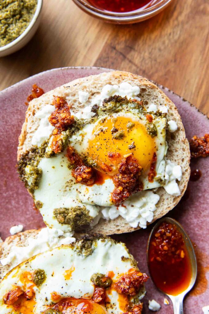 Pesto Eggs on a bagel slice.