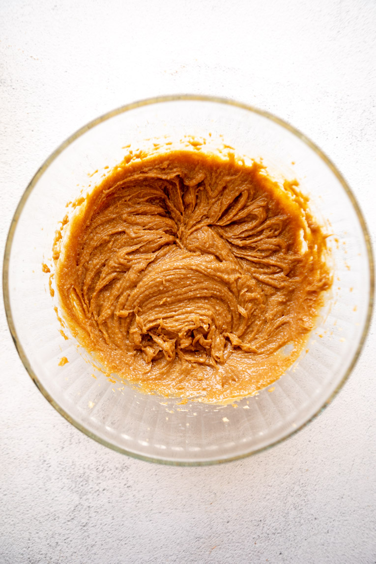 Liquid ingredients mixed into bowl for vegan cookie dough.