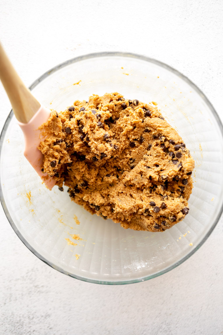 Chocolate chips folded into vegan peanut butter cookie dough.