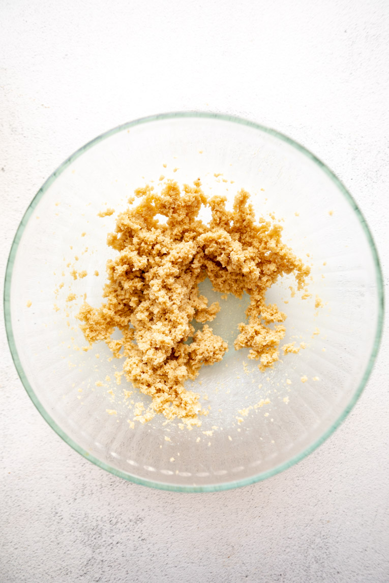 Butter and sugar in a bowl.