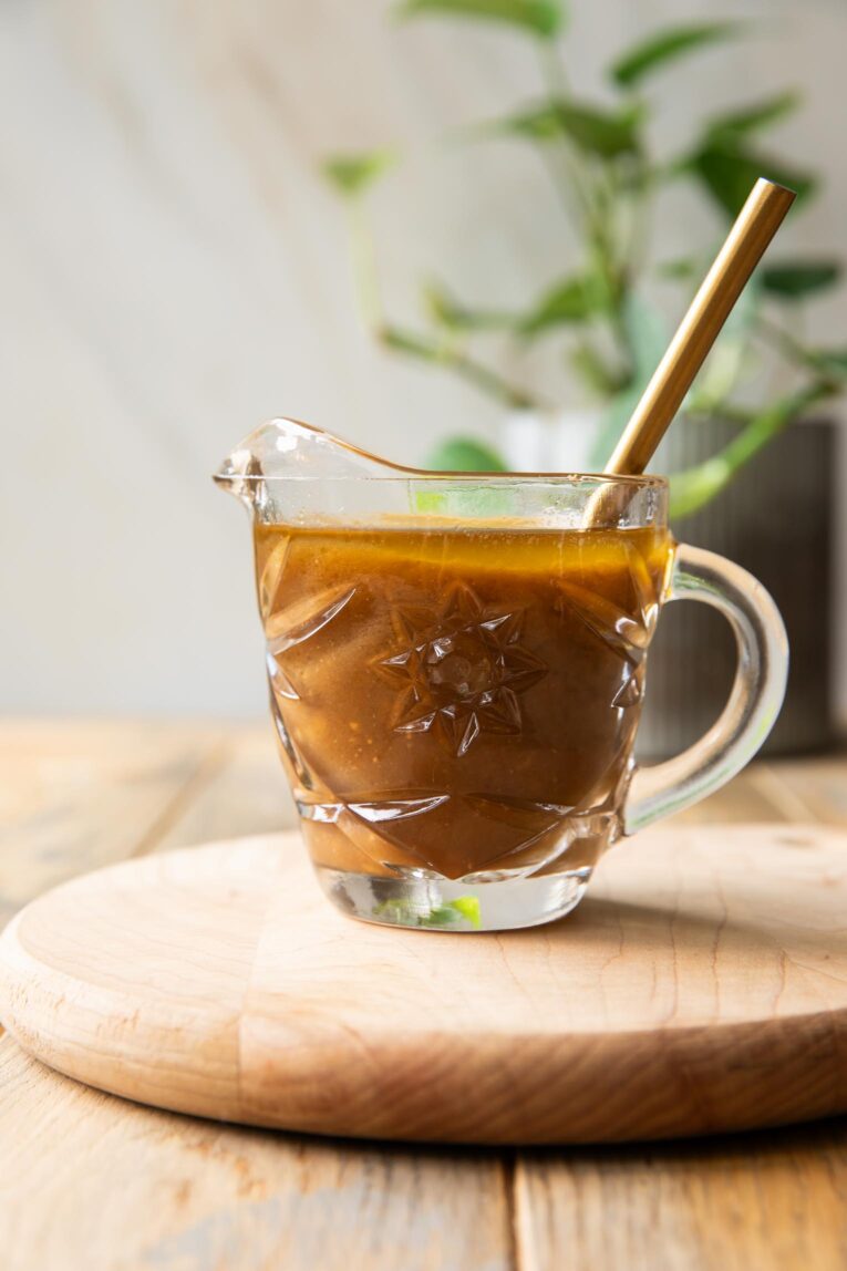 Balsamic Vinaigrette Recipe in a jar on a table.