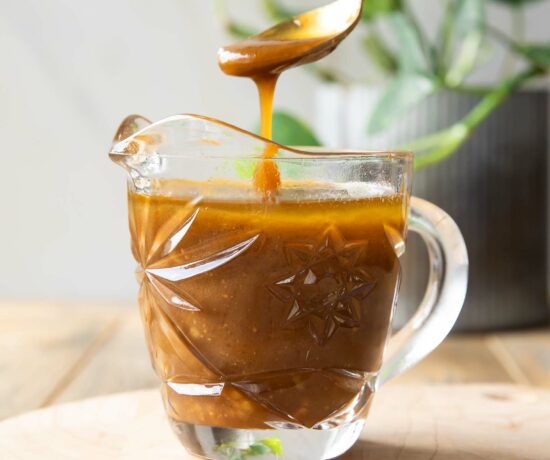 Spoon dipping into Balsamic Vinaigrette.