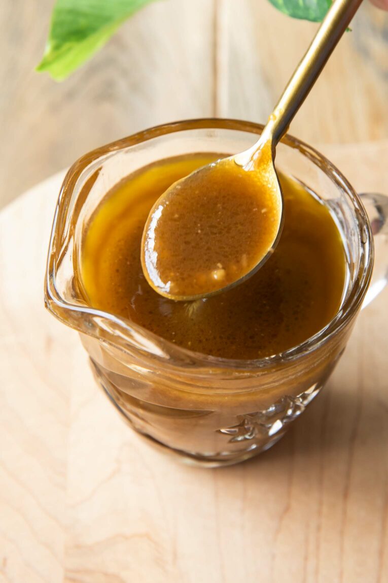 Top shot of spoon with Balsamic dressing.