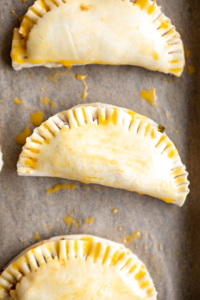 Chicken Empanadas on a baking sheet.