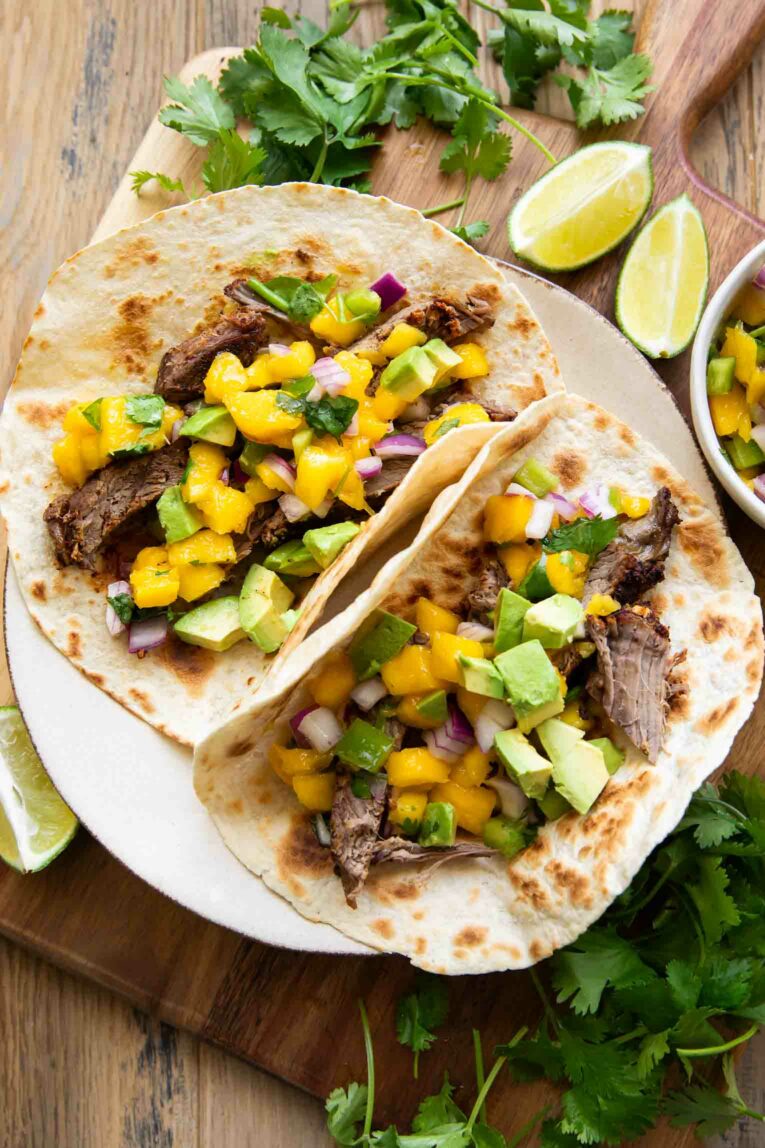 Chili Lime Steak Tacos w/ Mango Salsa on a plate.