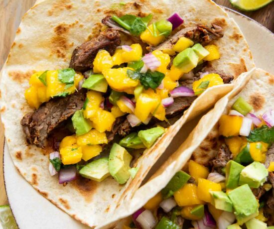 Close up of plated Chili Lime Steak Tacos w/ Mango Salsa.