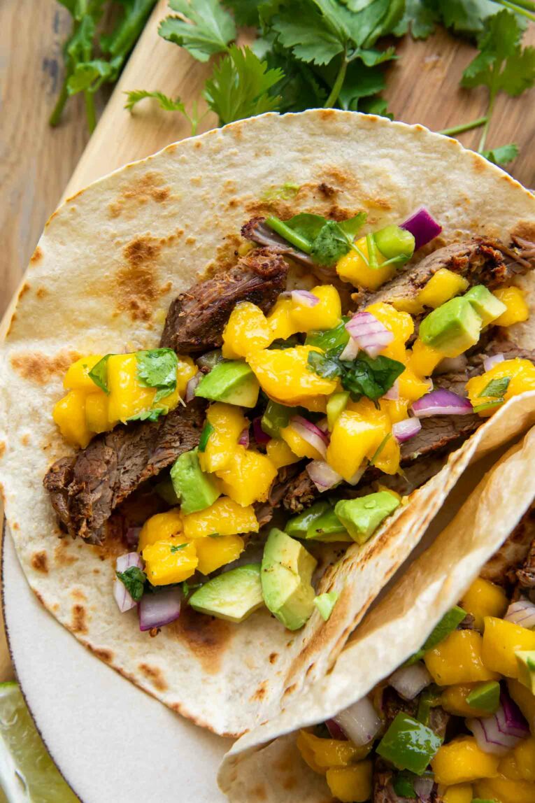 Close up of homemade steak tacos with salsa.