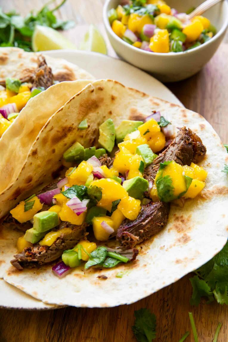 Angled photo of Chili Lime Steak Tacos w/ Mango Salsa.