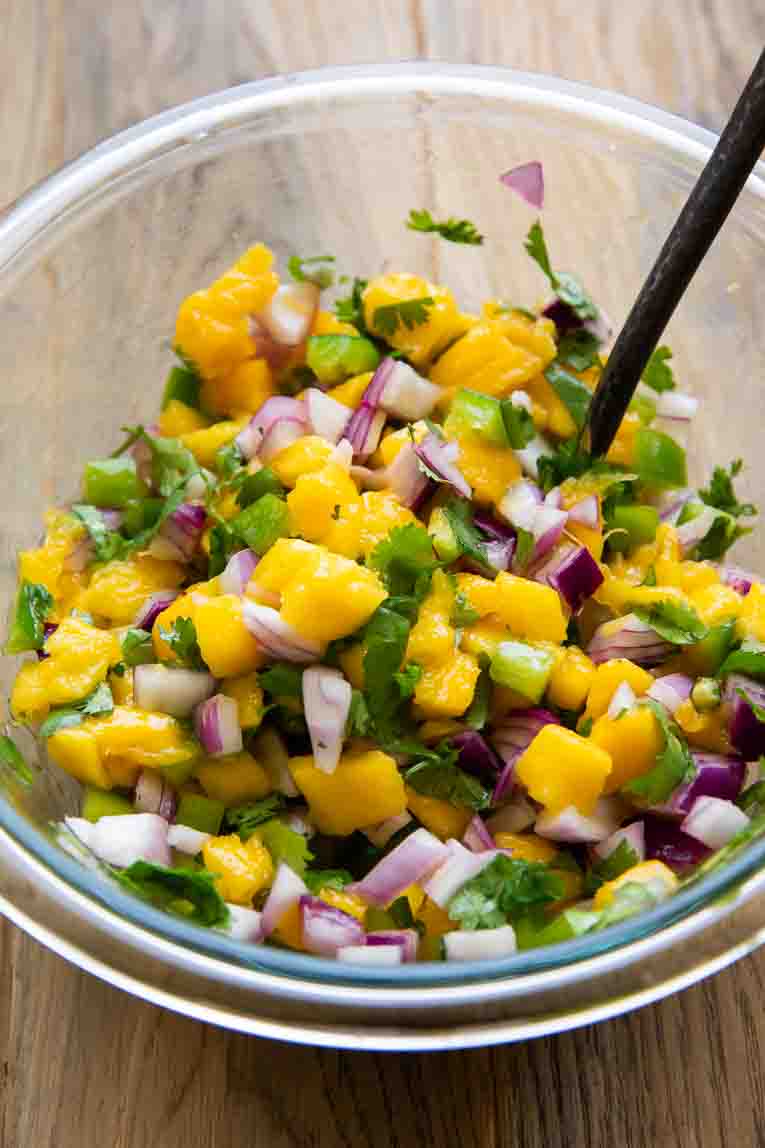 Mango salsa in a mixing bowl.