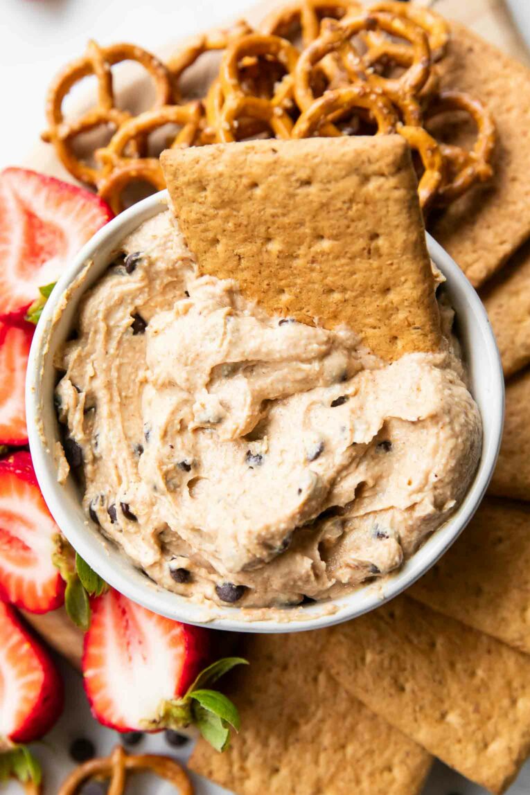 Top shot of healthy Cookie Dough Dip with fruit and crackers.