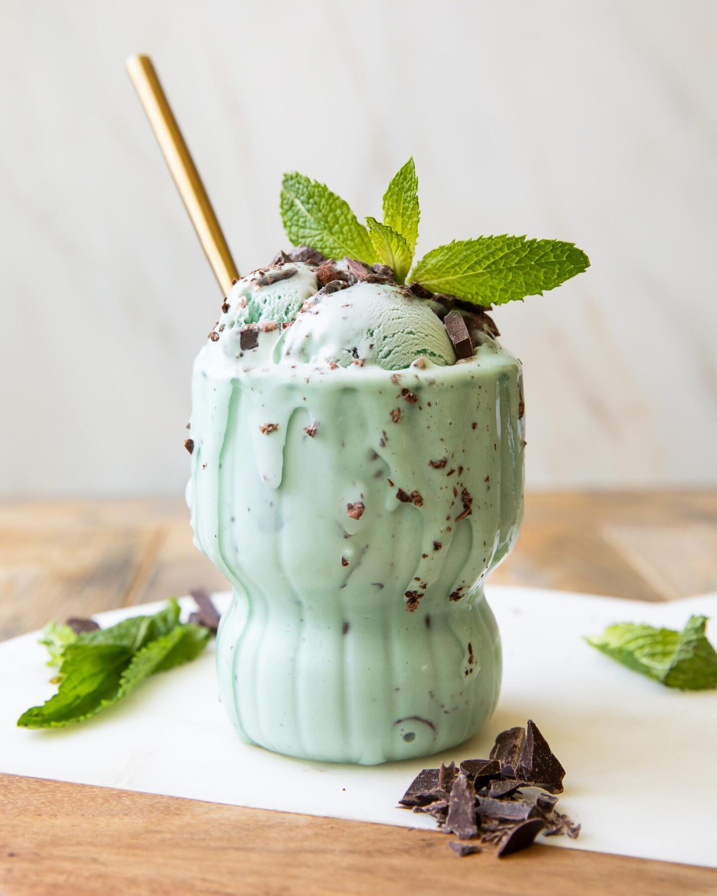 Close up of Healthy Mint Chocolate Chip Ice Cream scoops in a glass.