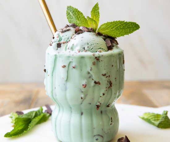 Close up of Healthy Mint Chocolate Chip Ice Cream scoops in a glass.