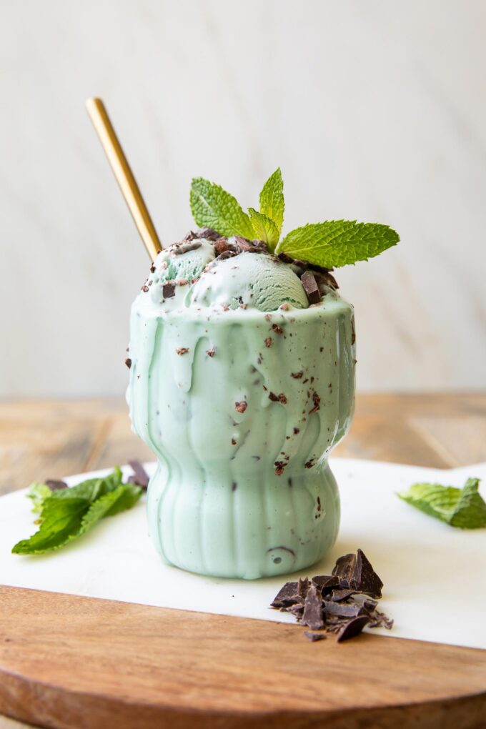 Close up of Healthy Mint Chocolate Chip Ice Cream scoops in a glass.