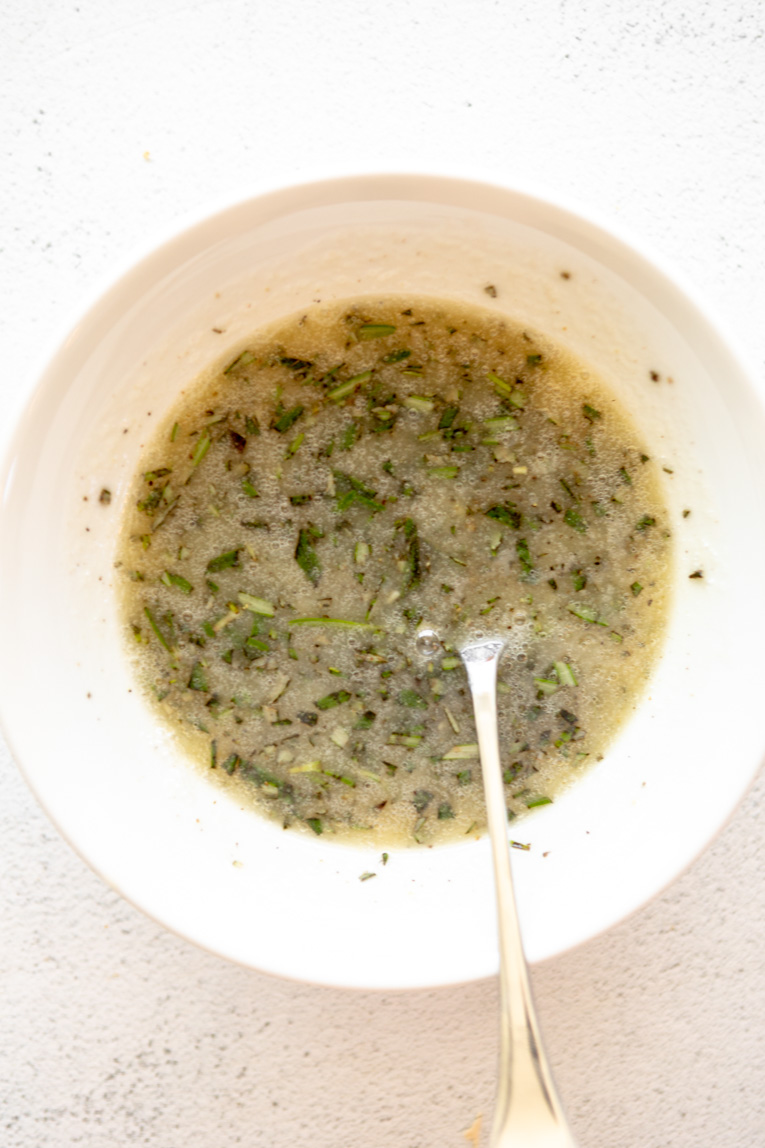 Honey rosemary sauce mixed in a bowl.