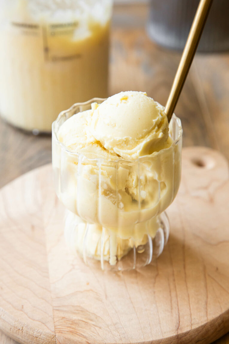 Close up of pineapple dole whip in a glass.