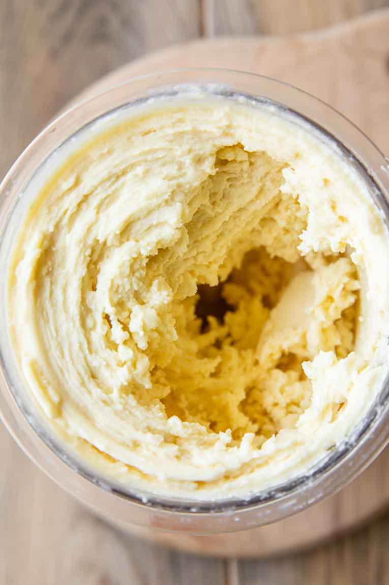Perfectly creamy pineapple dole whip in a container.