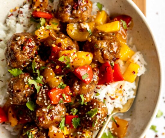 Sweet & sour meatballs with stir fry in a bowl.