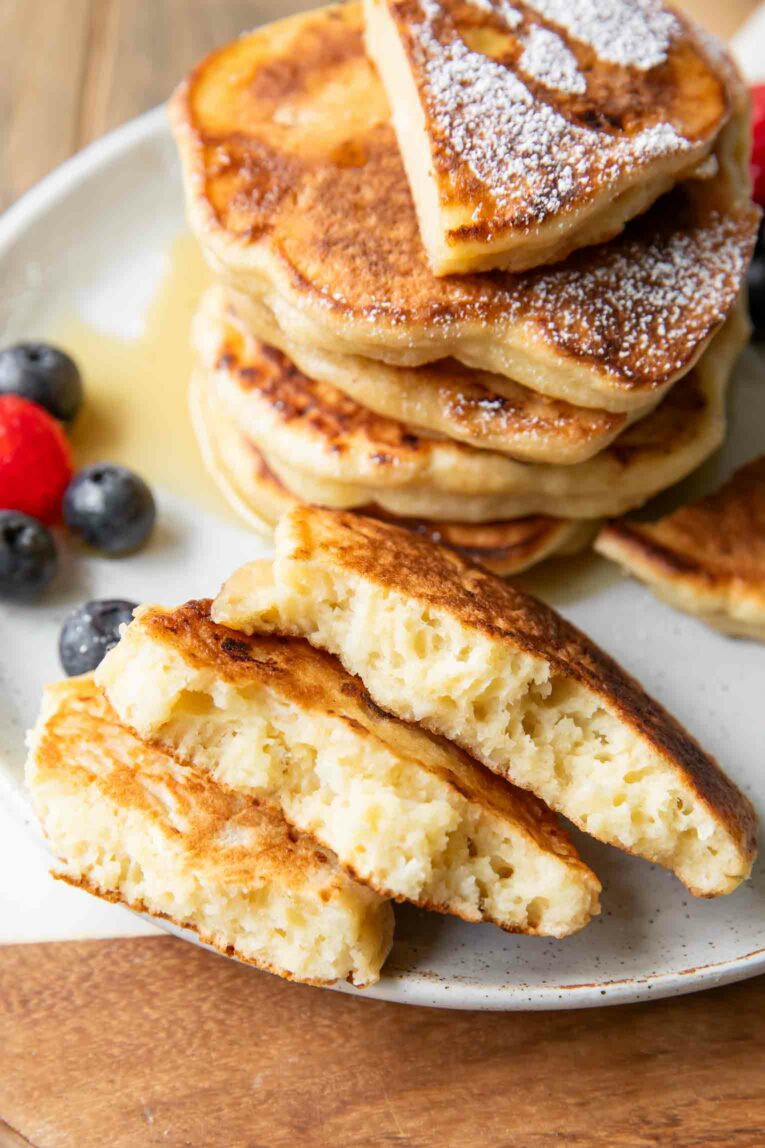 Bites taken out of Cottage Cheese Pancakes to show fluffy inside.