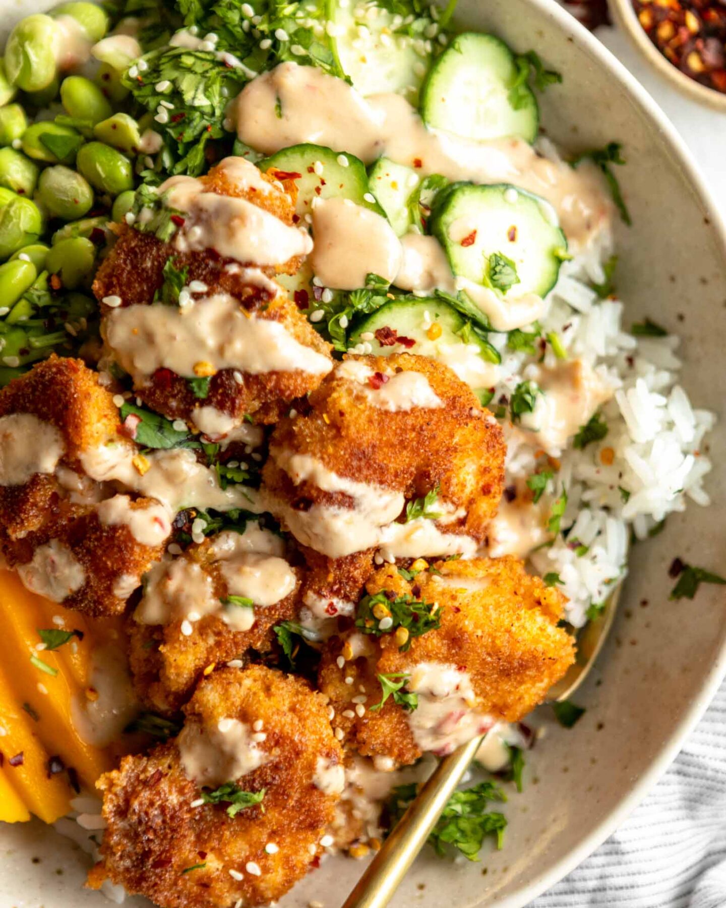 Top shot close up of Fried Shrimp Bowl with rice and veggies.