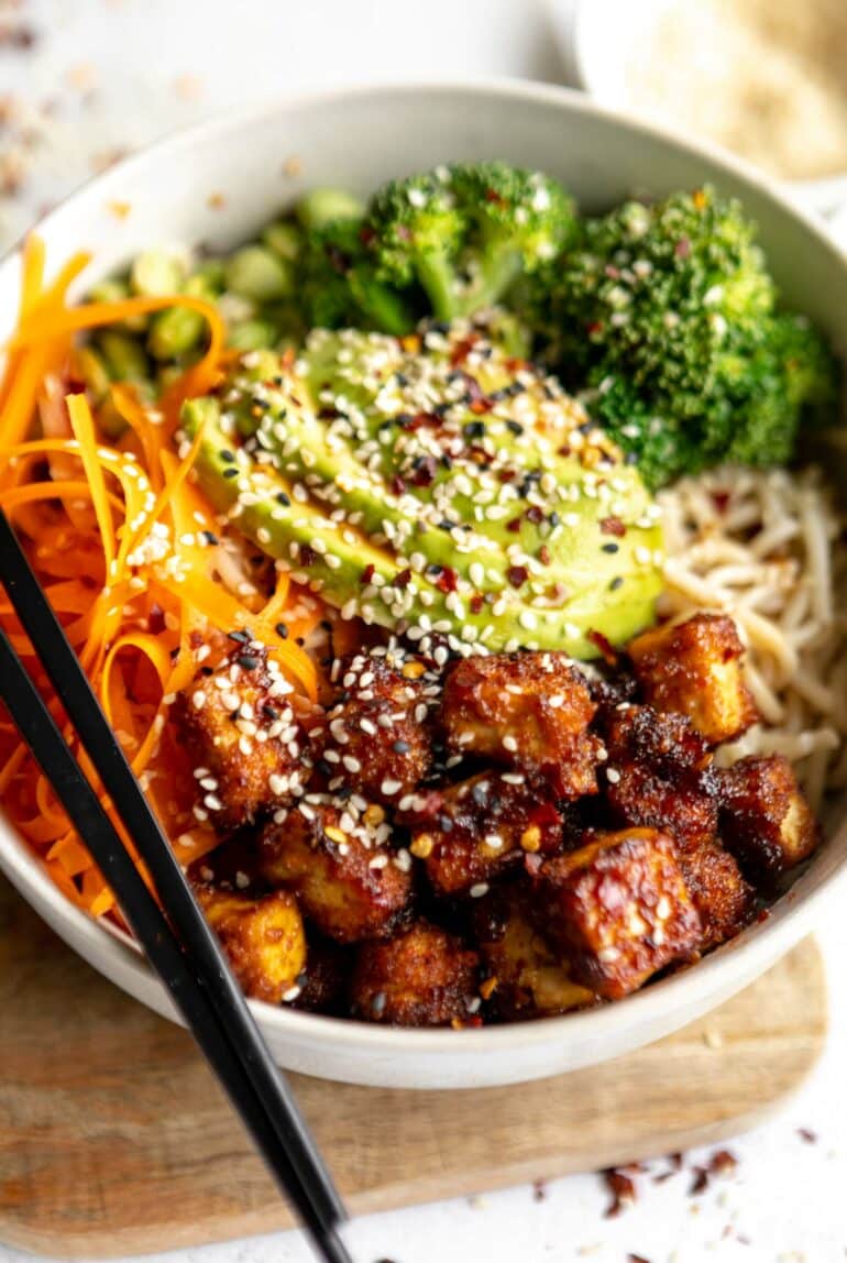 Angled photo of Fried Tofu in a bowl with veggies.