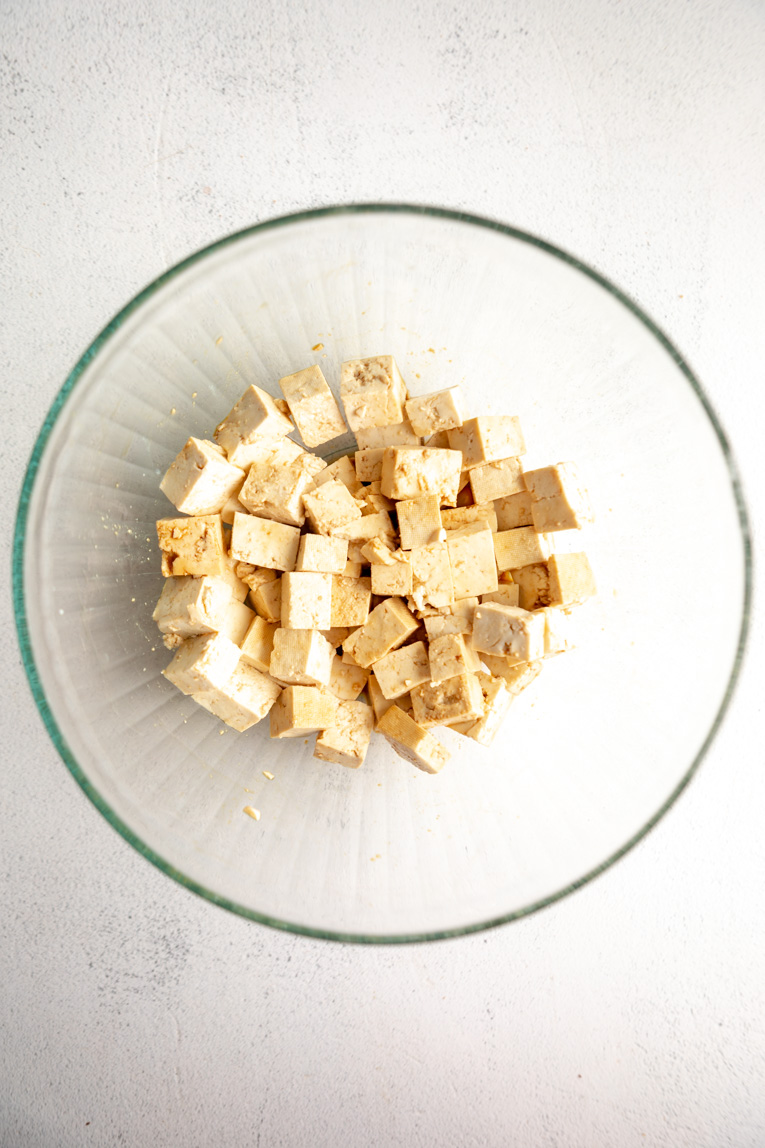 Extra firm tofu in a bowl.