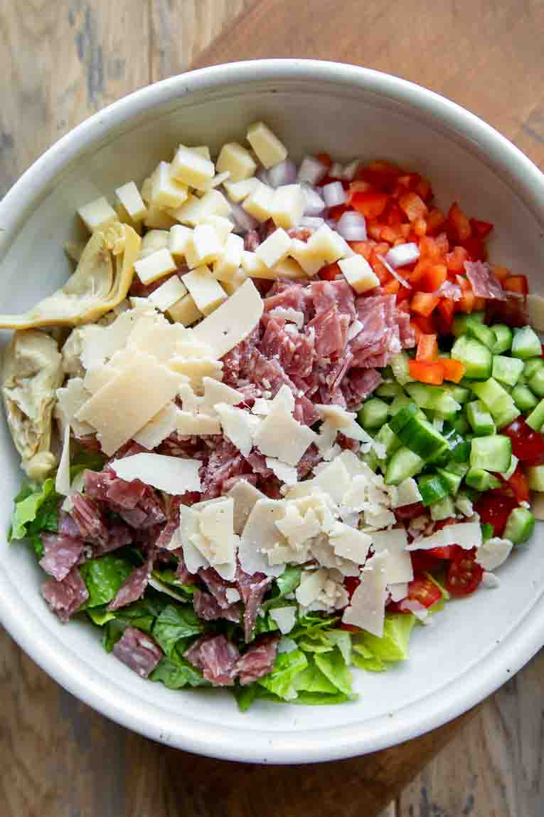 Italian Chopped Salad ingredients placed in a large bowl
