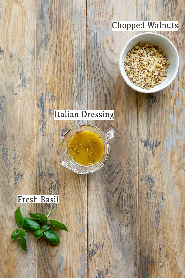 Italian dressing, basil, and walnuts for Italian Chopped Salad recipe.