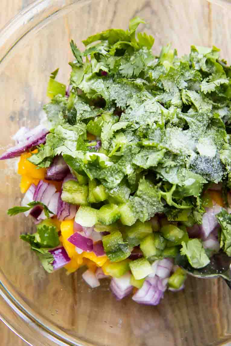 Mango Salsa ingredients in a large bowl.