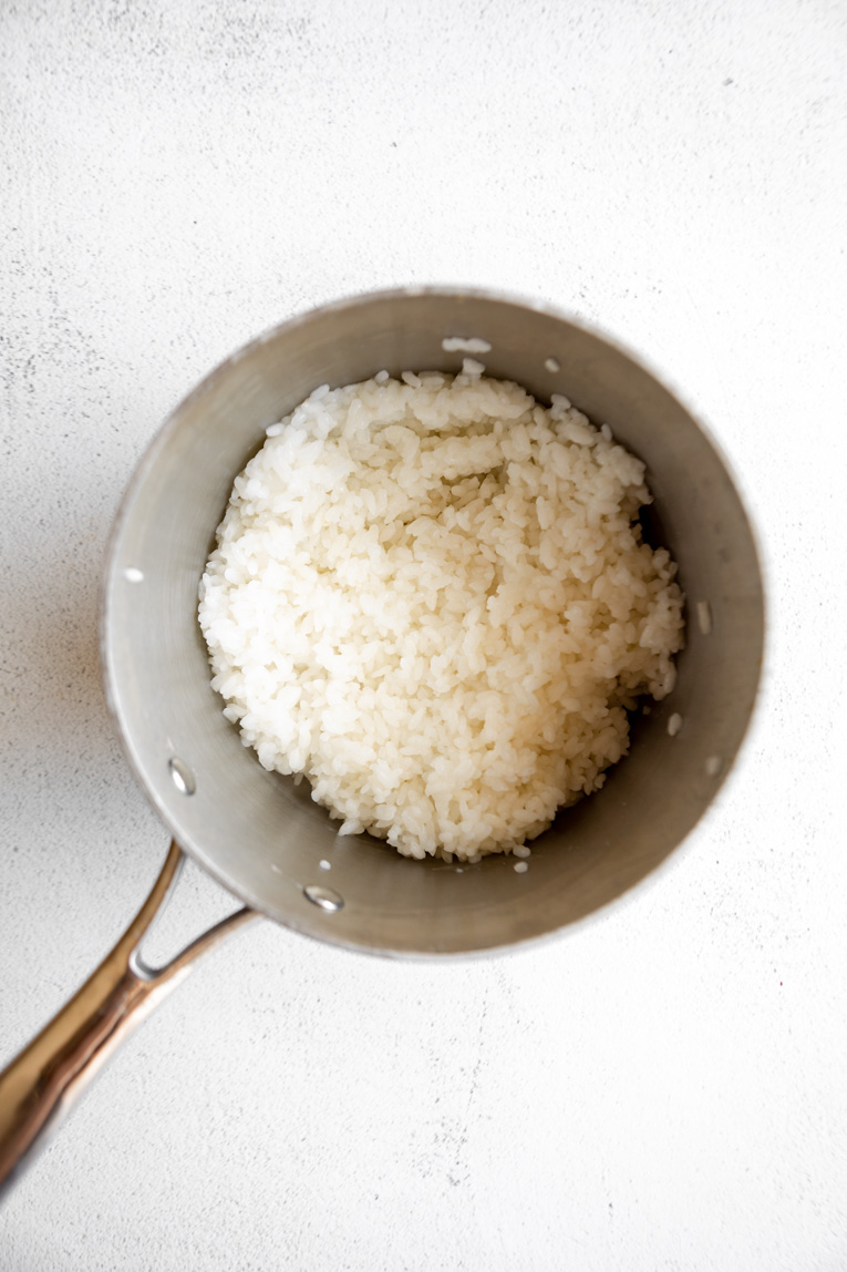 Freshly cooked rice in a pot.
