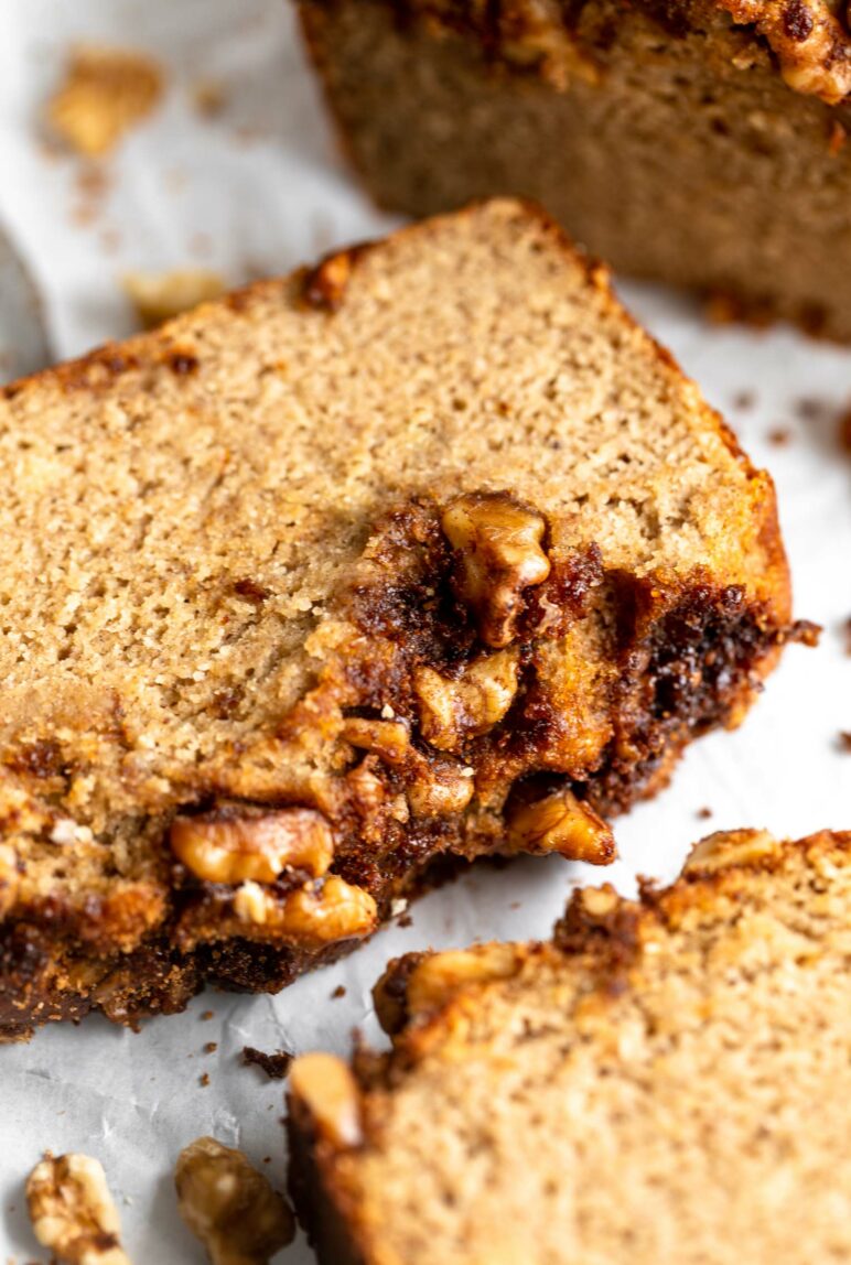 Angled photo of Almond Flour Banana Bread with chopped walnut topping.