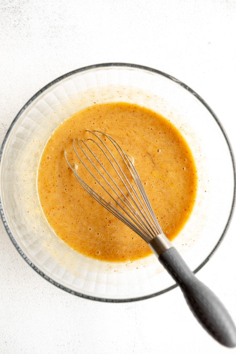 Liquid ingredients for Almond Flour Banana Bread recipe.