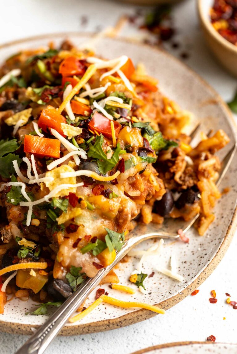 Beef and rice recipe on a plate with cheese.