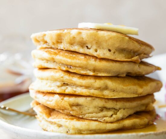 Close up of Gluten-Free Pancakes stacked on a plate.