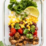 Meal Prep Southwest Chicken Burrito Bowl in a container for lunch idea.