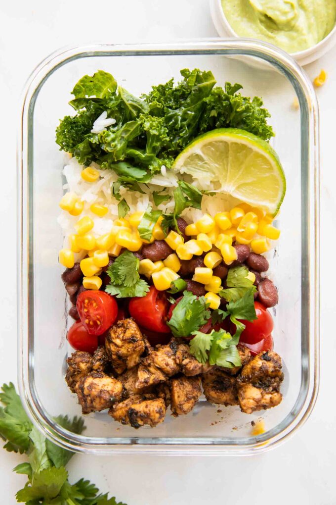 Meal Prep Southwest Chicken Burrito Bowl in a container for lunch idea.