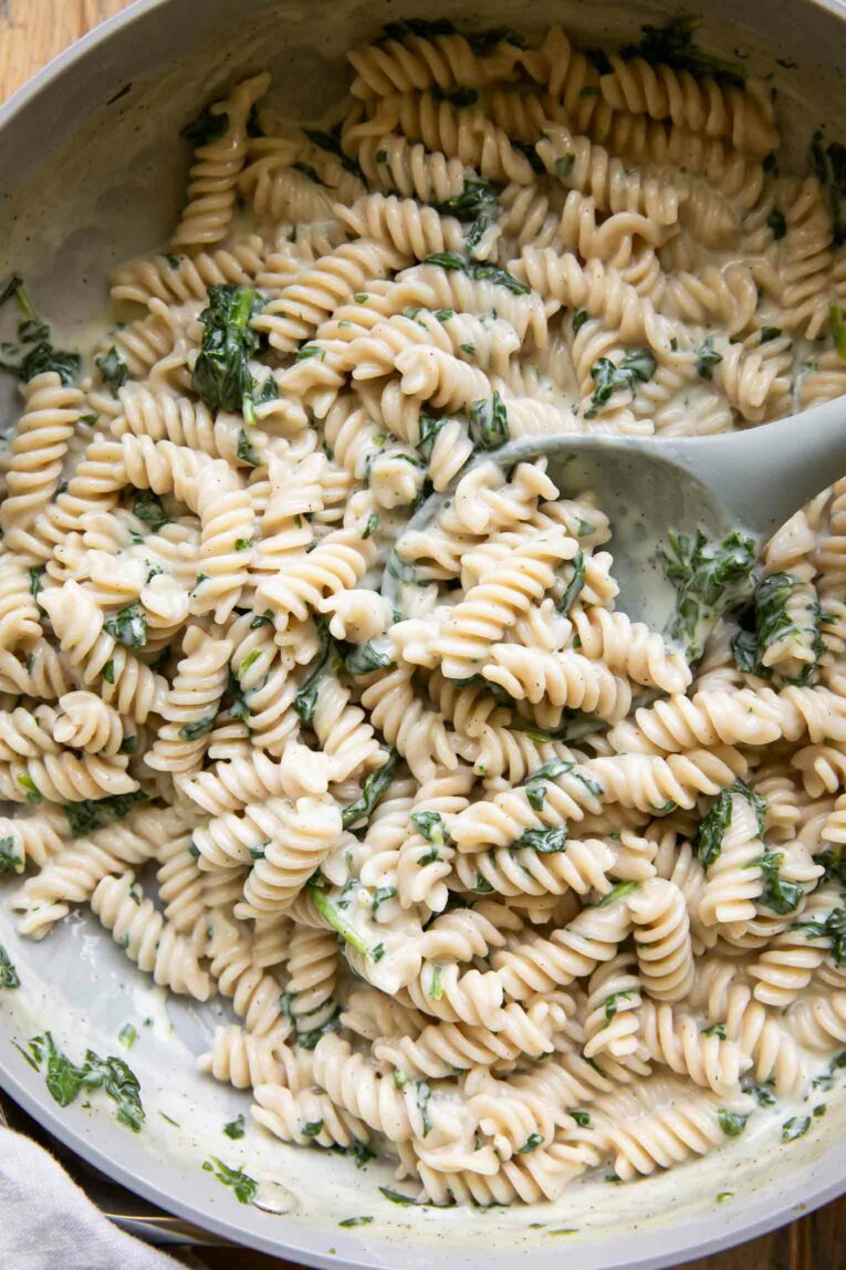 Protein Pasta Recipe in a skillet with a spoon.