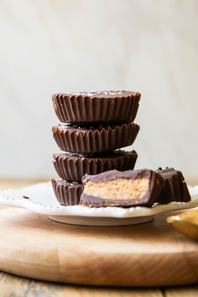 Across photo of stacked healthy peanut butter cups on a plate.