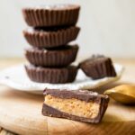 Across photo of healthy peanut butter cups stacked.