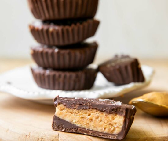 Across photo of healthy peanut butter cups stacked.