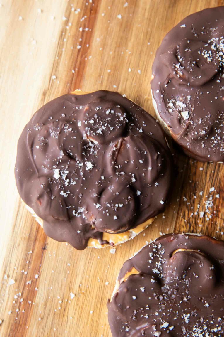 Healthy peanut butter cup rice cakes on a cutting board.