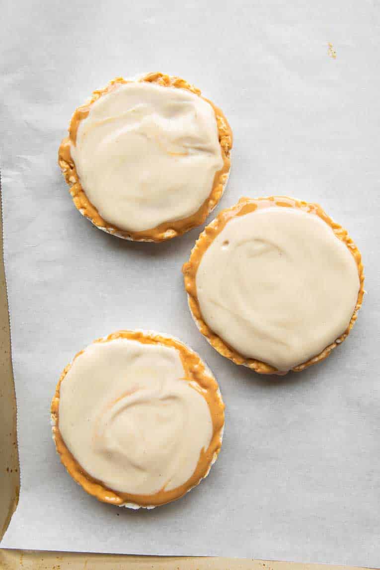 Protein yogurt mixture over peanut butter on rice cakes.