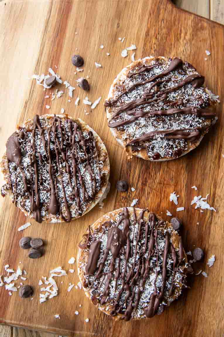 Healthy samoa cookie rice cakes on a cutting board.