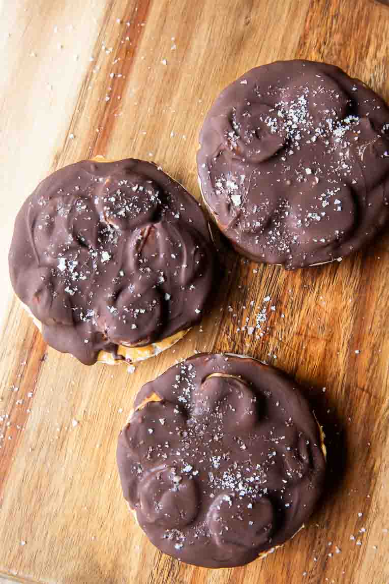 Healthy peanut butter cup rice cakes on a cutting board.