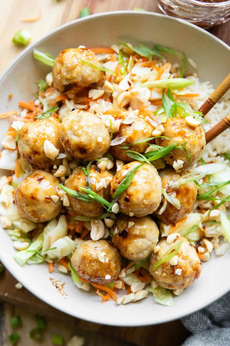 Close up of Sweet Chili Chicken Meatballs in a bowl with rice.